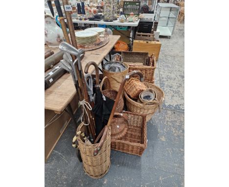 A collection of various baskets to include a stick stand containing sticks and golf clubs