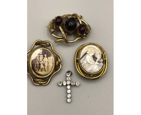 An antique paste and hallmarked silver cross pendant, three vintage gilded brooches to include a cameo, a swizzle brooch with