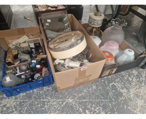 Vintage light bulbs, glass light shades, a wall clock, chandeliers, etc.