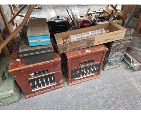 An Aiwa turntable, two telephone exchange units, a cased slide projector, a thermometer, a tin cash box, etc