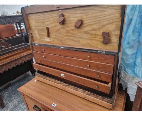 A vintage multi-drawer tool cabinet.