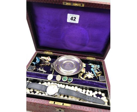A vintage jewellery box and contents to include a manual wound, Derrick wristwatch, various brooches, beads etc and a sterlin