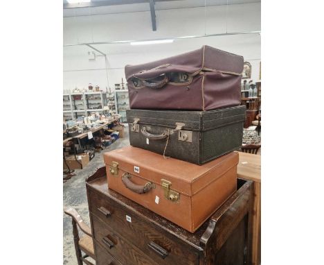Three vintage leather dressing cases.
