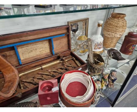 A cased BOC universal blow pipe and fittings, a leather stirrup, shirt collars, a Bell's whisky bottle. a model tricycle, etc
