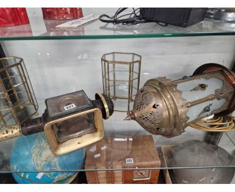 A candle powered car lamp, a ceiling lantern and two brass and glass display cases