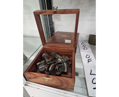 A boxed miniature sextant together with a boxed brass compass