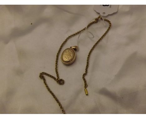 UNMARKED YELLOW METAL LOCKET & CHAIN EST [£12- £25]