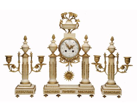 A LATE 19TH CENTURY FRENCH WHITE MARBLE AND ORMOLU MOUNTED GARNITURE DE CHEMINÉE, the clock with vase finial, the drum moveme