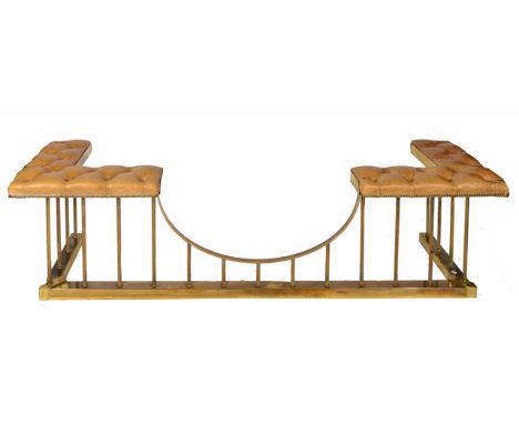 A 20TH CENTURY BRASS CLUB FENDER with light brown button upholstered corners and reeded column supports, 205cm wide