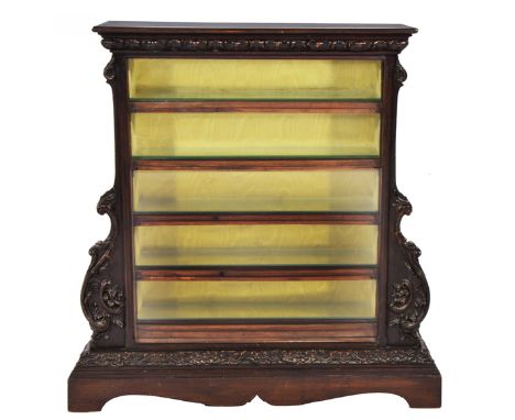 A DARK STAINED AND GESSO MOULDED TABLE TOP DISPLAY CABINET, the glazed front showing five drawers accessible from either side