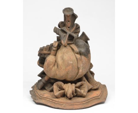 A 19TH CENTURY CARVED WOODEN WALL BRACKET, supported by various musical instruments to include bagpipes, 37cm wide x 40cm hig