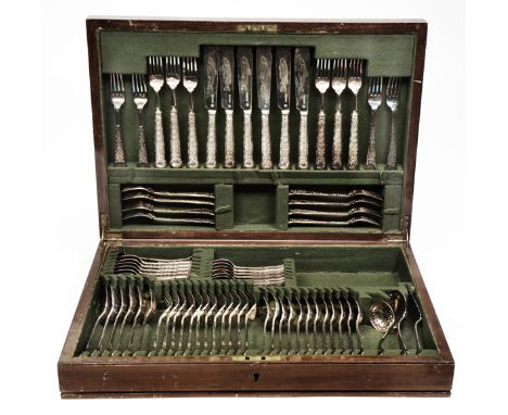A VICTORIAN SILVER CANTEEN OF CUTLERY, each piece with shell scroll and husk decoration consisting of 12 table forks, 12 dess