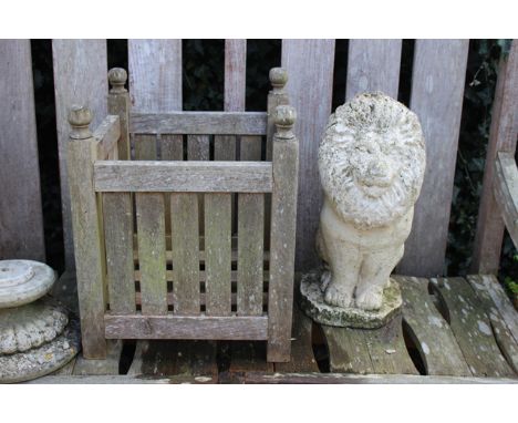 A RECONSTITUTED STONE SCULPTURE in the form of a lion, 48cm high, together with a square garden planter with ball finials, 40