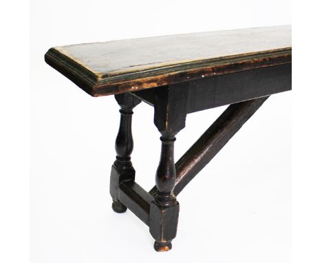 AN ANTIQUE OAK BENCH or form, with turned pegged legs, 259cm long x 54cm high