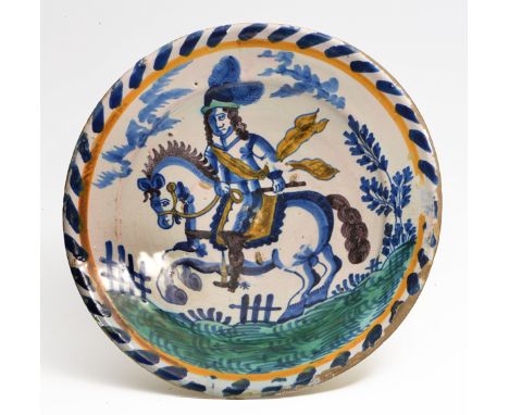 A LATE 17TH CENTURY BLUE DASH CHARGER, POSSIBLY FRIESIAN, C.1690, depicting a horseman with feathers in his hat and a sash bl