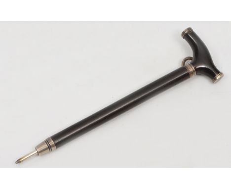 AN ANTIQUE WHITE METAL MOUNTED PROPELLING PENCIL in the form of a walking stick, the top removing to expose a toothpick withi