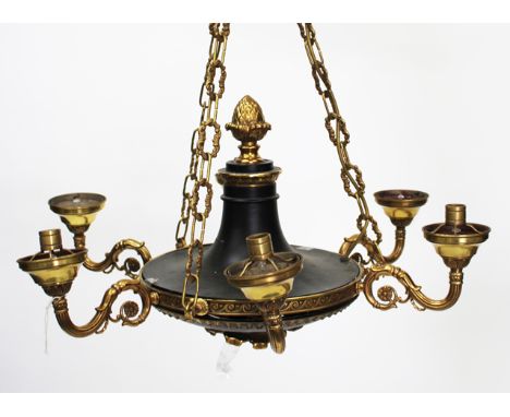 A SIX LIGHT EMPIRE STYLE HANGING LIGHT FITTING painted black with gilt metal mounts and scrolling arms, approximately 38cm hi