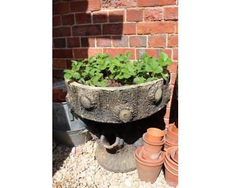 AN EARLY 20TH CENTURY STONEWARE STRAWBERRY PLANTER, of naturalistic form, the top with a 52cm diameter planted with strawberr