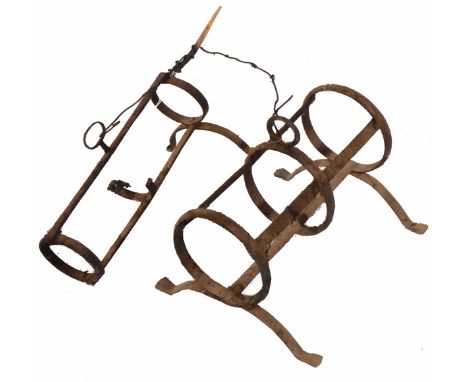 AN 18TH OR 19TH CENTURY WROUGHT IRON PIPE KILN of typical form, 34.5cm wide together with a further smaller pipe kiln, 33.5cm
