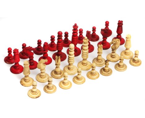 A 19TH CENTURY ORIENTAL TURNED BONE CHESS SET, the king measuring 5.5cm in height