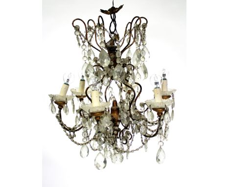 A GILT METAL SIX LIGHT ELECTROLIER, with swags of glass drops hanging from the scrolling arms, approximately 50cm high, toget