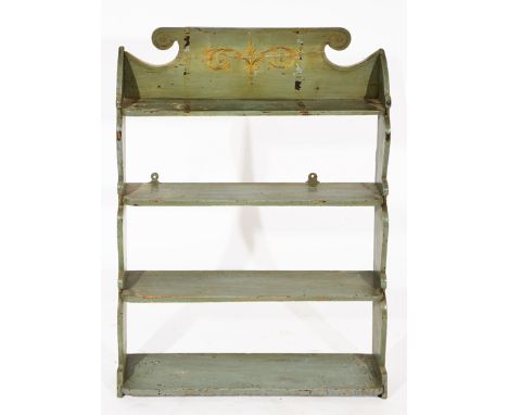 AN ANTIQUE GREEN PAINTED WALL SHELF, gilt decoration to the shaped crest with four graduated shelves, 63.3cm wide x 82cm high