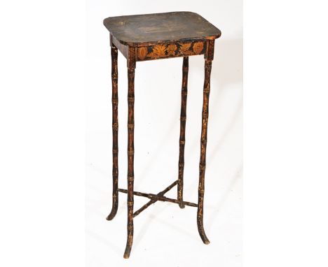 A REGENCY PENWORK BLACK LACQUERED LAMP TABLE, the top decorated in gold with a chariot pulled by two horses surrounded by a f