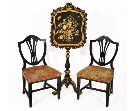 A PAIR OF EDWARDIAN EBONISED HEPPLEWHITE STYLE SHIELD BACK DINING CHAIRS with tapestry upholstered seats and square tapering 