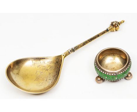 A CONTINENTAL SILVER GILT 17TH CENTURY STYLE SPOON with a fig shaped bowl and mask finial, engraved decoration and inscribed 