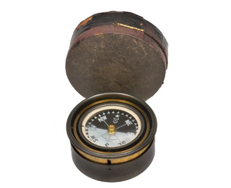 A LATE 19TH OR EARLY 20TH CENTURY LACQUERED COMPASS ON A GIMBAL with fitted case, the mother-of-pearl dial signed 'G Wilson, 