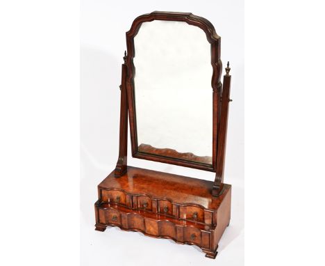 A 19TH CENTURY BURR WALNUT VANEERED DRESSING TABLE MIRROR, the swinging mirror above shaped front with three short drawers ab