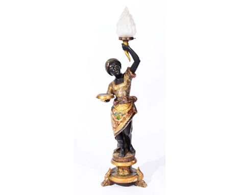 A 19TH CENTURY ITALIAN CARVED PAINTED AND PARCEL GILT BLACKAMORE TORCHERE FIGURE holding a glass shaded lamp aloft and a circ