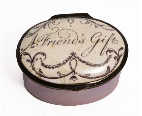 A GEORGE III OVAL ENAMEL PATCH BOX with purple ground base, the lid printed with scrolls and inscribed 'A Friend's Gift', 4.1
