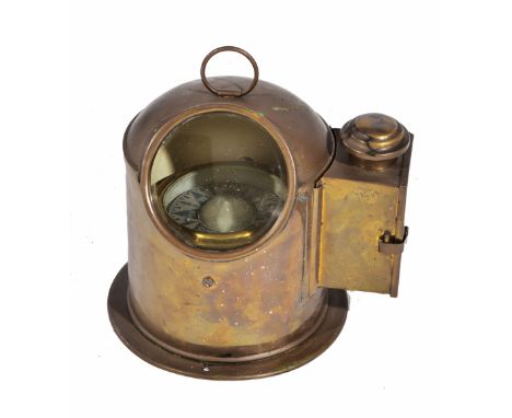 A BRASS YACHT OR SHIPS GIMBAL COMPASS and a case with lantern to one side, 27cm high overall with the ring up and 26cm wide o