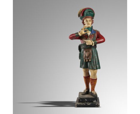 Collectibles: A polychrome painted wood tobacconist’s figure of a Scotsman holding a snuff mull  2nd half 20th century 210cm 