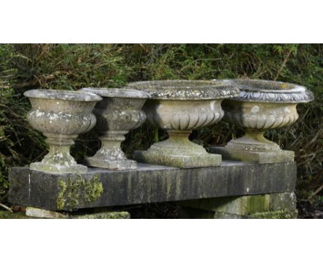 Planter: Two pairs of composition stone urns  2nd half 20th century the larger 57cm diameter, together with a larger urn, 94c