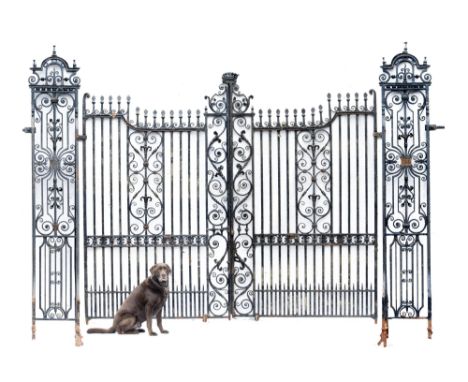 Architectural: An identical impressive pair of Georgian style gates  last quarter 19th century the gates surmounted by an ear