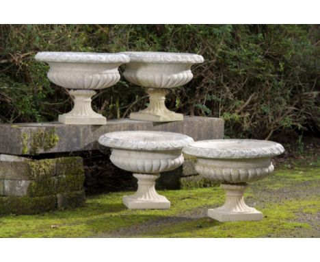 Planter: A similar set of four composition stone urns (similar to lot 306)