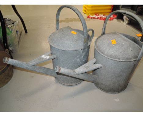 Two vintage galvanised watering cans