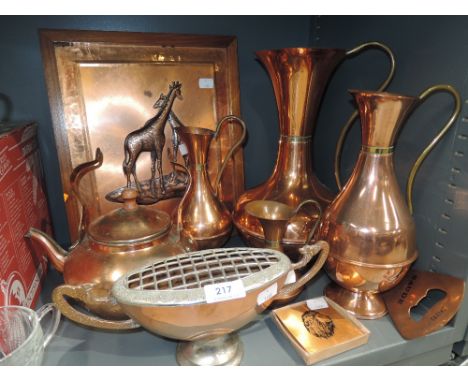 A selection of vintage copper wares including giraffe plaque