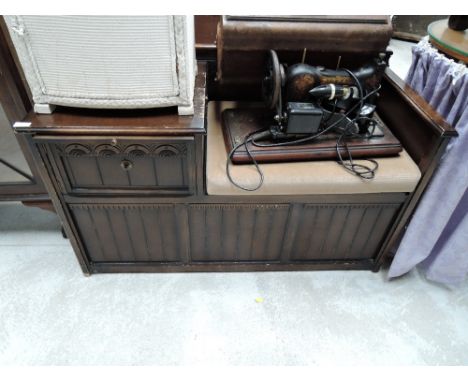 A vintage stained frame telephone seat