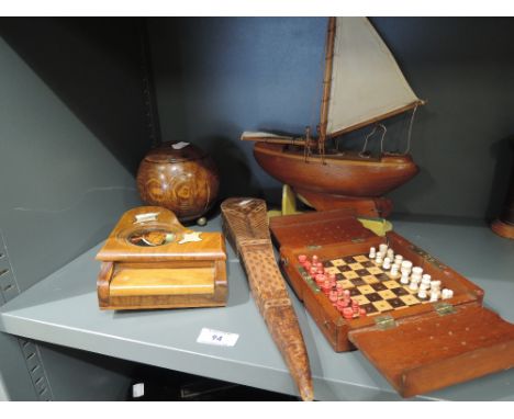 A selection of treen items including a folding travel chess set, a tea caddy etc