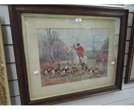 A vintage print of fox hunt and hounds