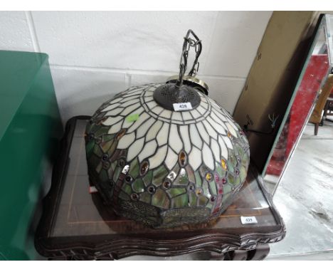 A Tiffany style ceiling light shade having dragonfly decoration