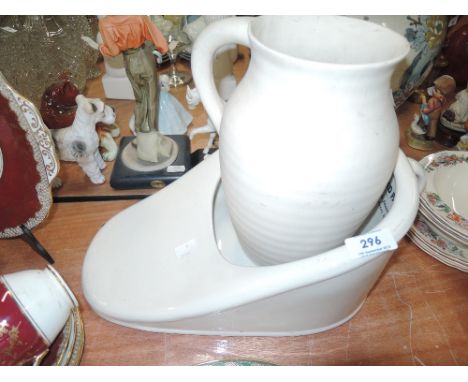 A slip pan and ceramic jug