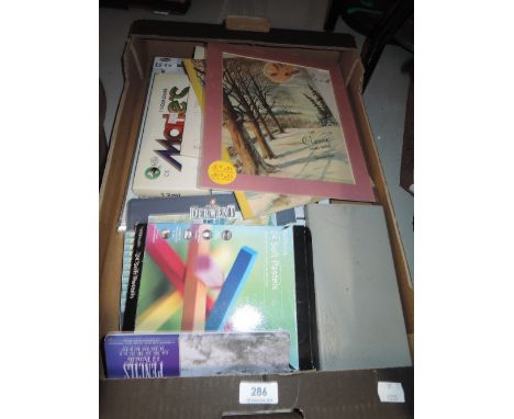 A selection of vintage art supplies and artist materials