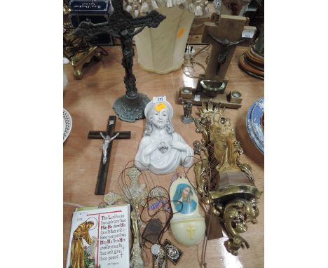 A selection of vintage religious items including effigy crucifix etc