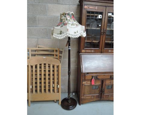 A vintage oak column standard lamp and shade