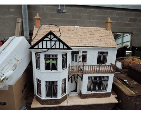 A vintage dolls house76cm high76cm wide47 cm deep