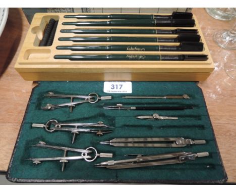 A vintage calligraphy set and geometry set